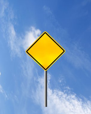 Blank yellow road warning sign on sky clipart