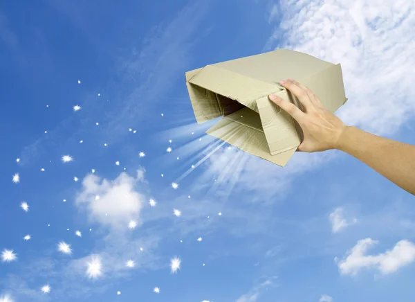 Open magic gift box on sky background — Stock Photo, Image