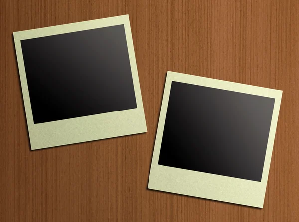 Blank photos on a wood background — Stock Photo, Image