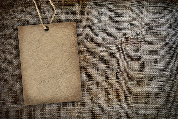 Textura de fondo arpillera vintage con etiqueta — Foto de Stock