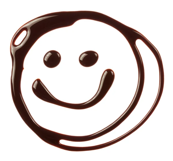 Улыбающееся лицо из шоколадного сиропа — стоковое фото