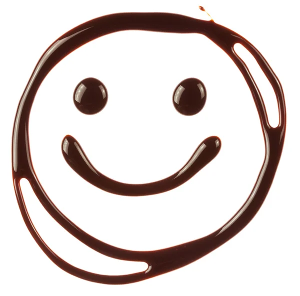 Cara sonriente hecha de jarabe de chocolate — Foto de Stock