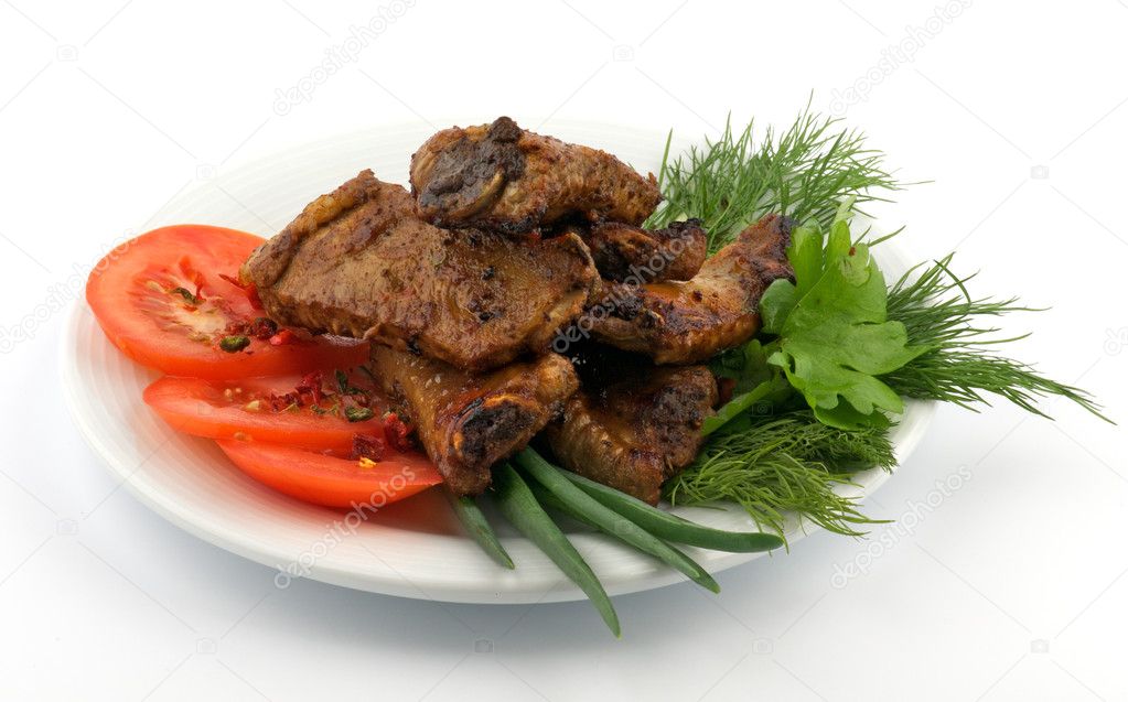 Barbecued pork ribs on white plate