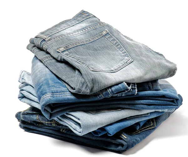 Стопка складных старых джинсов — стоковое фото