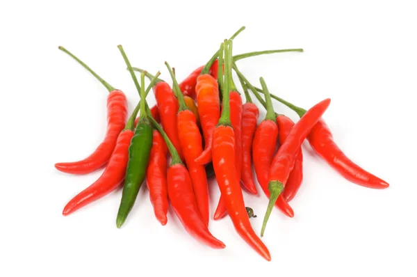 One Green between red chili peppers — Stock Photo, Image