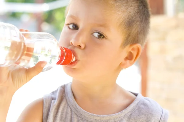 Little boy drinking water — Stock Photo, Image
