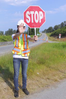 Traffic Controller Stopping Traffic clipart