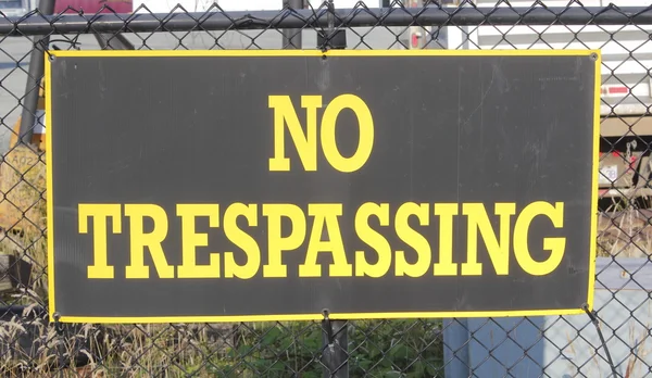 No Trespassing Sign on Fence