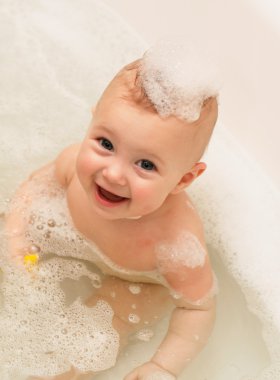 Adorable bath baby with soap suds clipart