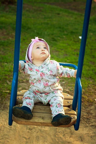 Little girl on the swings — Stock Photo, Image