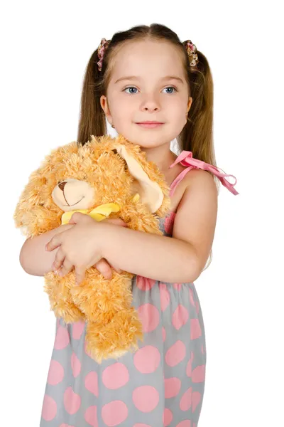 Porträtt av söta leende liten flicka med leksak — Stockfoto