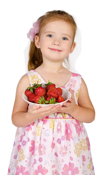 Portrait of cute little girl holding bowl with strawberry — Stock Photo, Image