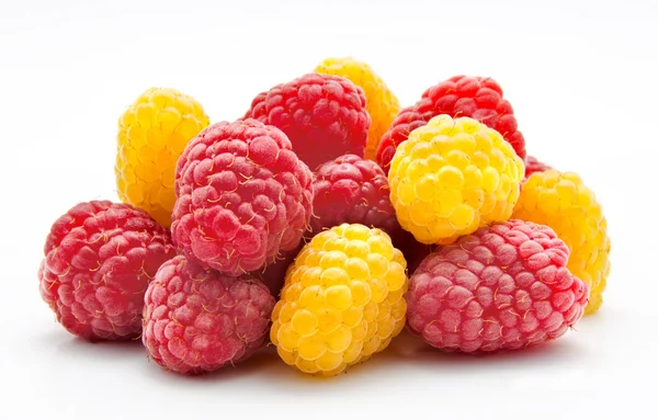 Heap of red and yellow raspberry on white — Stock Photo, Image