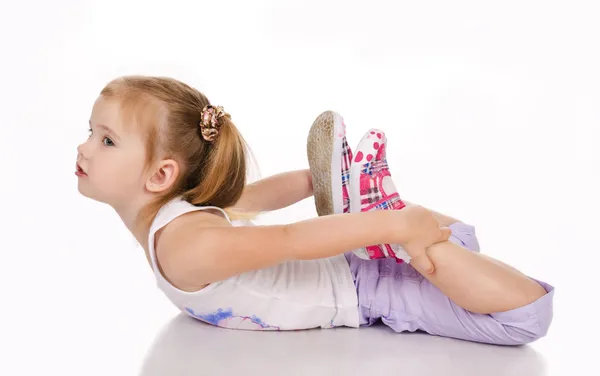 Гімнастка мила дівчинка ізольована — стокове фото