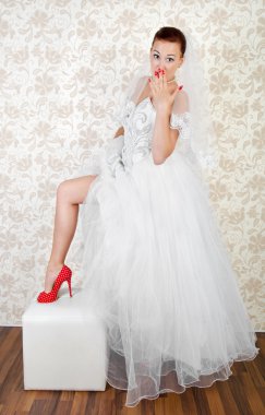 Portrait of young beautiful bride in shoes