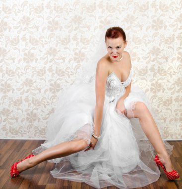 Portrait of young beautiful bride in shoes