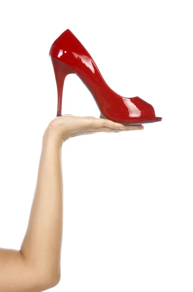 Sujetando zapato rojo — Foto de Stock