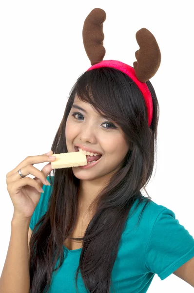 Santa žena jíst oplatka — Stock fotografie