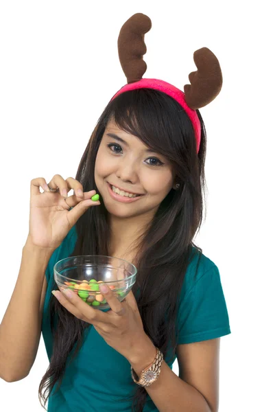 Santa nő eszik édességet — Stock Fotó