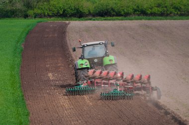 Farmer ploughing field clipart