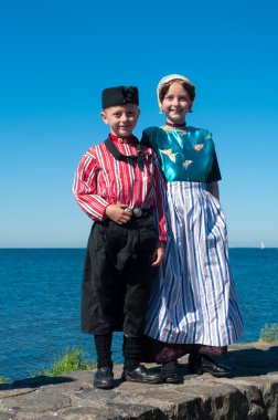 Children in traditional costumes clipart