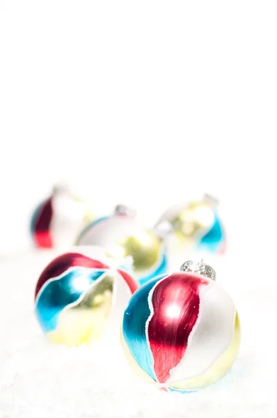 stock image Hand painted Christmas baubles on snow
