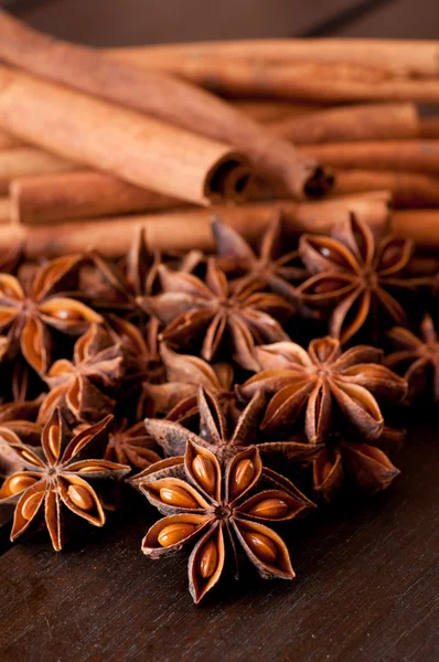 Star anise and cinnamon close up on wooden table — Stock Photo, Image