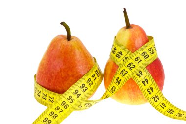 Two pears with tape measure on waistes. clipart