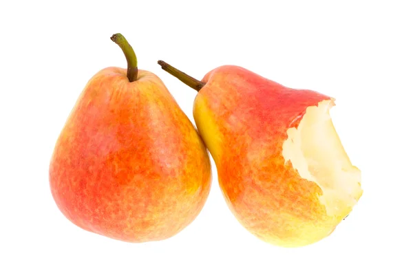 The whole pear and the bitten-off pear. — Stock Photo, Image