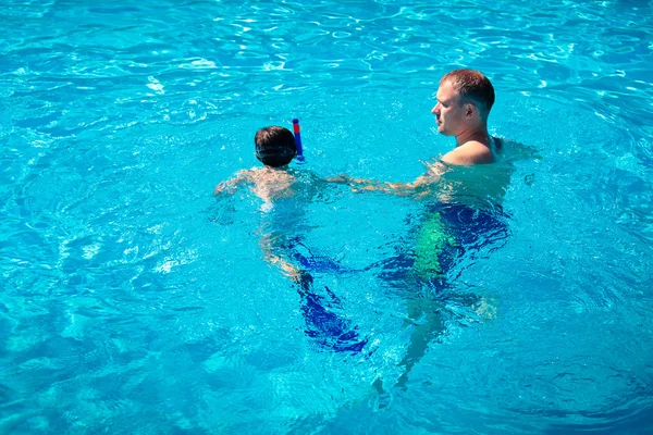 stock image Father teaching his little son to swim