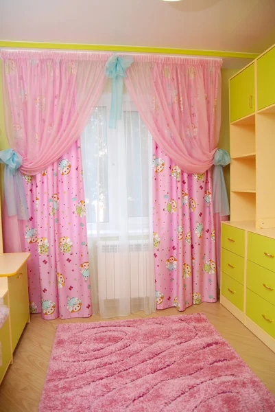 Pink curtains in a nursery — Stock Photo, Image