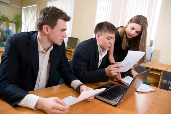 Team of young works with documents — Stock Photo, Image