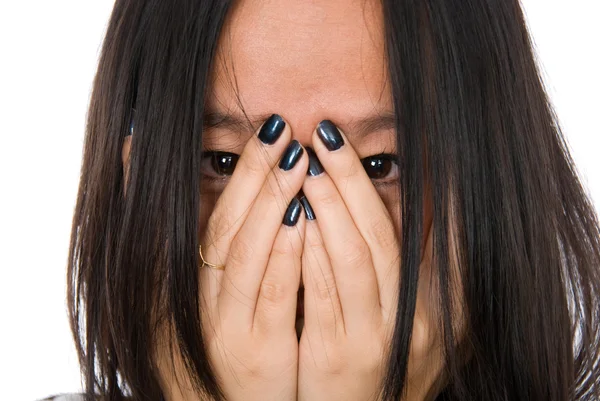 Close-up portrait girl in despair shuts face with hands — Stock Photo, Image