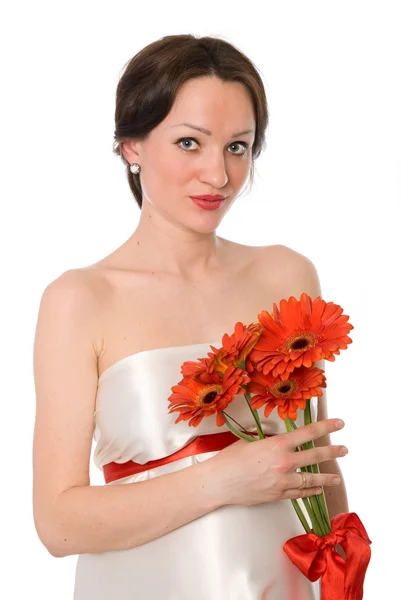 Pregnant woman with a bunch of flowers — Stock Photo, Image