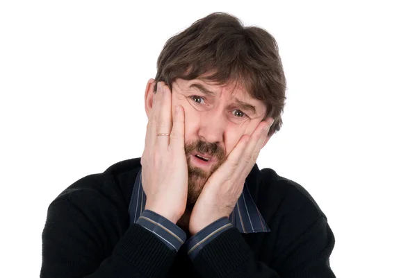 Portrait of upset man with hands on cheeks — Stock Photo, Image