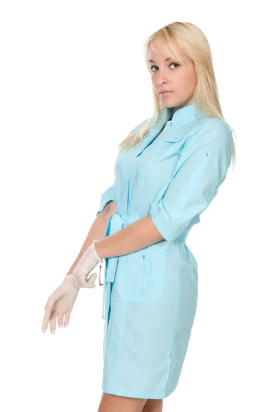 The female doctor putting on gloves. — Stock Photo, Image