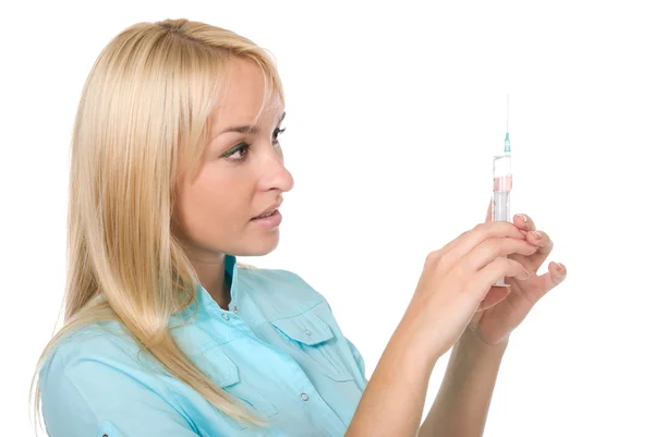 Portrait of female doctor holding a hand a syringe — Stok fotoğraf