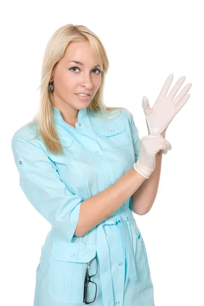 The doctor puts on gloves. — Stock Photo, Image