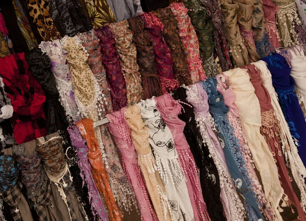 stock image Multicoloured scarves on market