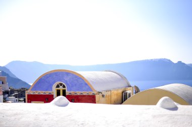 View of Oia colorful roofs , Santorini island , Greece clipart