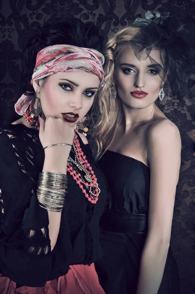 Portrait of gorgeous gypsy woman with another women — Stock Photo, Image
