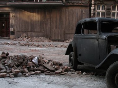 Old car beside vintage old house clipart