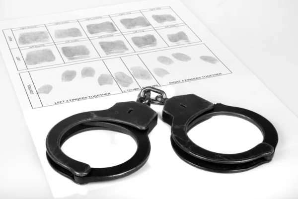 Handcuff and fingerprint — Stock Photo, Image