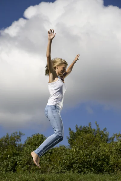 stock image Young girl jumping in air