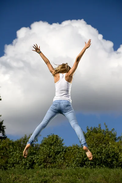 stock image Young girl jumping in air