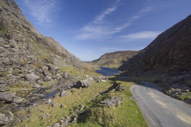 Mountain road leading into Gap of Dunloe vallery located in Kill clipart