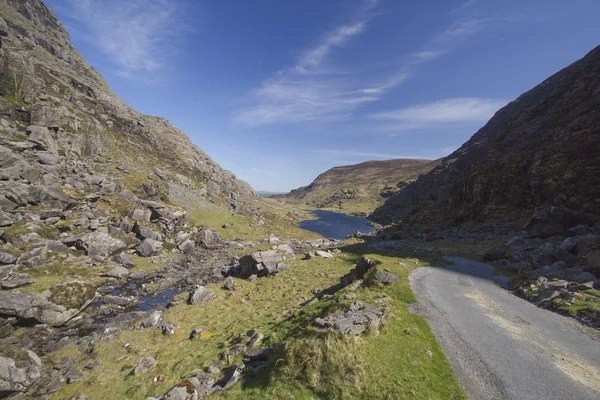 Mountain road leading into Gap of Dunloe vallery located in Kill Royalty Free Stock Images