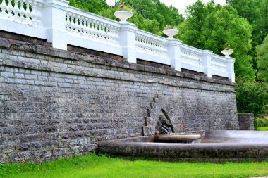 Old fountain with three fishes clipart