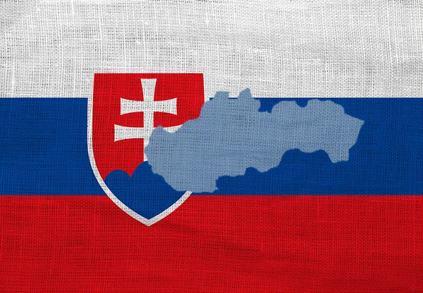Flagga och karta över Slovakien på en säckväv — Stockfoto