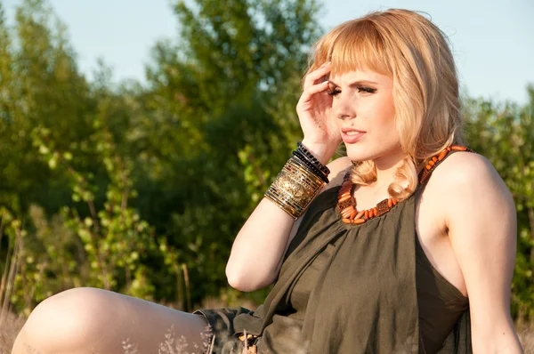 Thoughtful blonde girl in a blouse of khaki — Stock Photo, Image